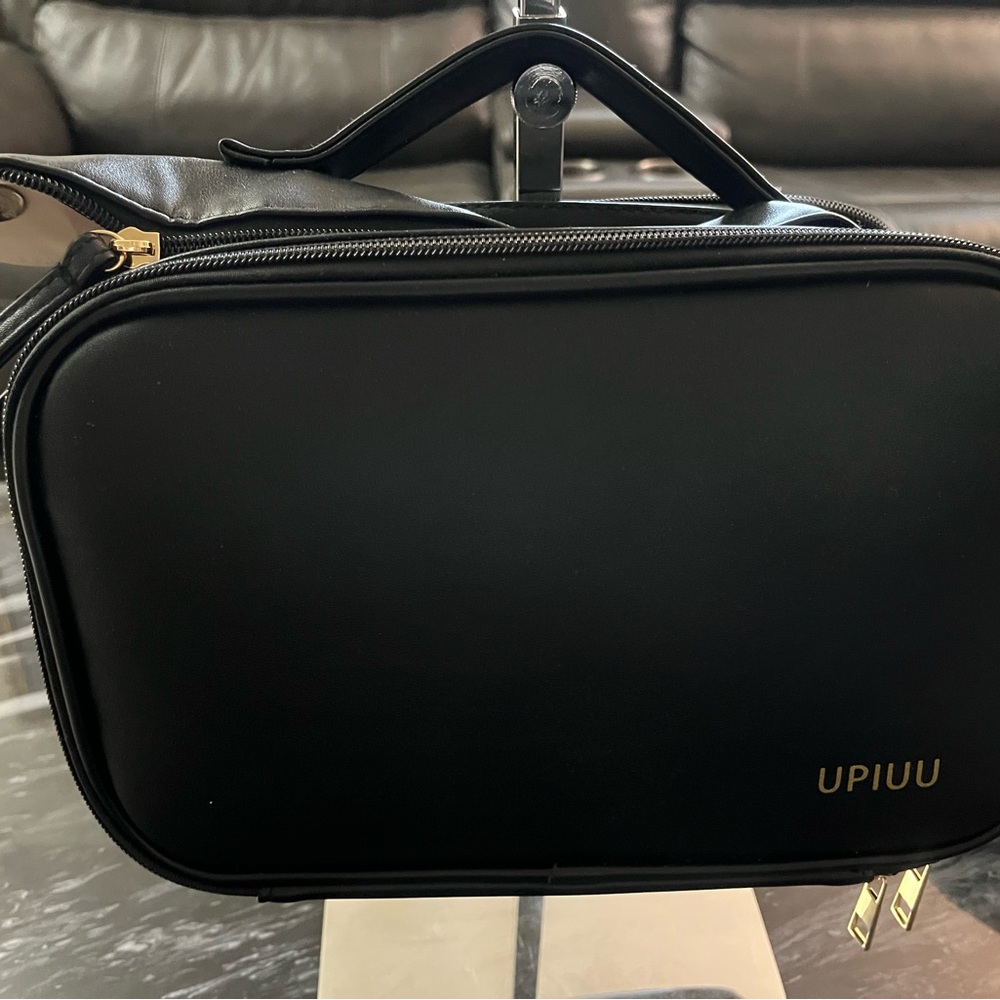 Black and brown make up bag
